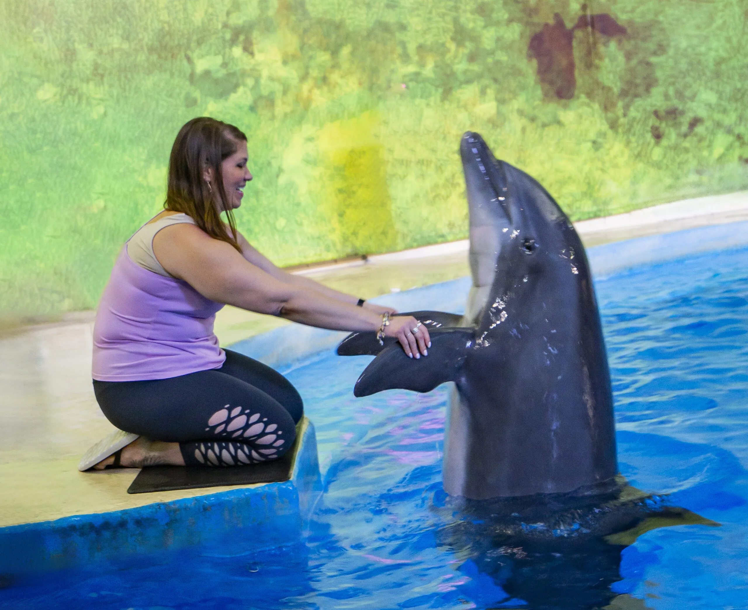 Woman holding dolphin fins