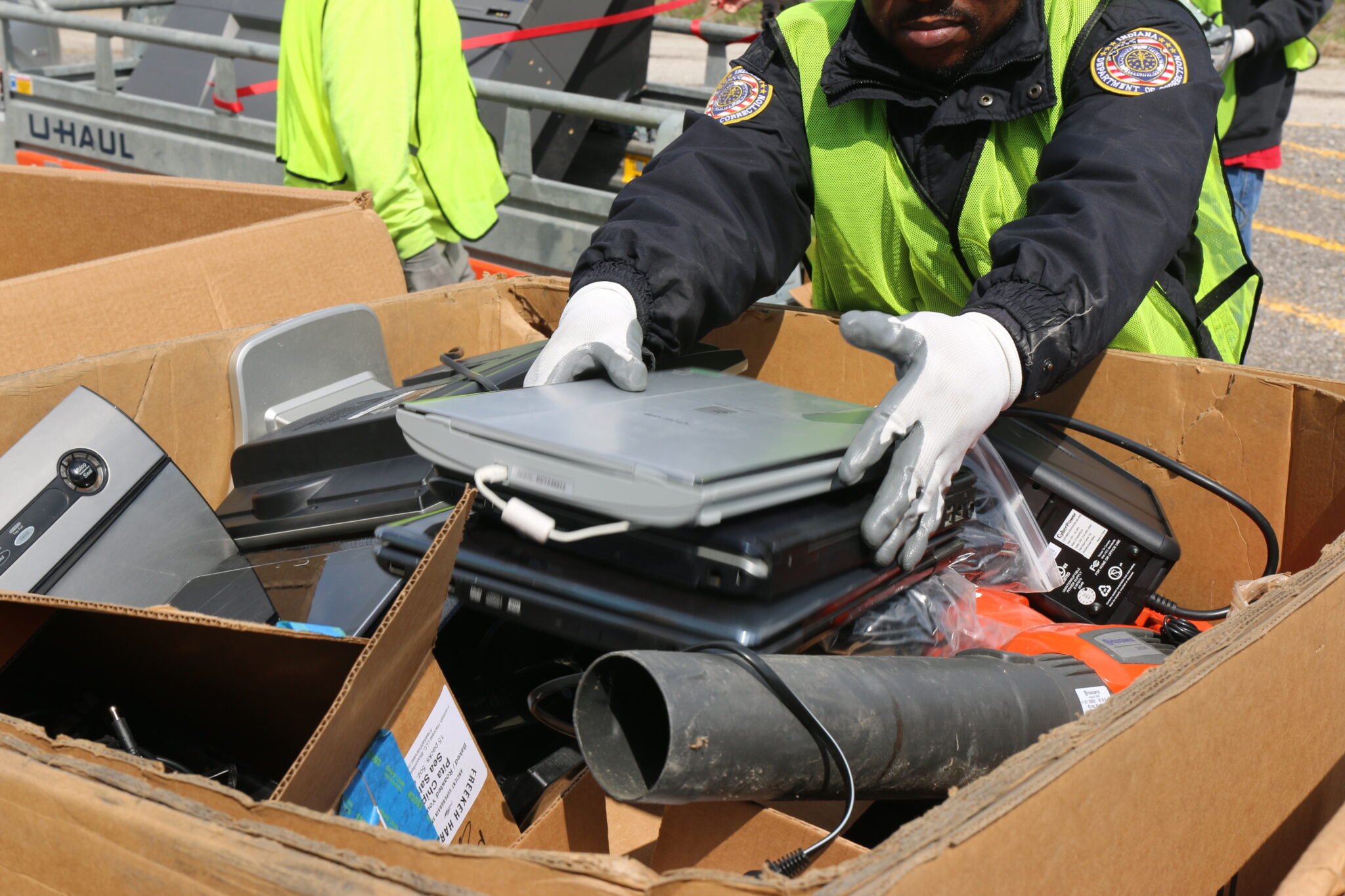 recycling box full of old electronics