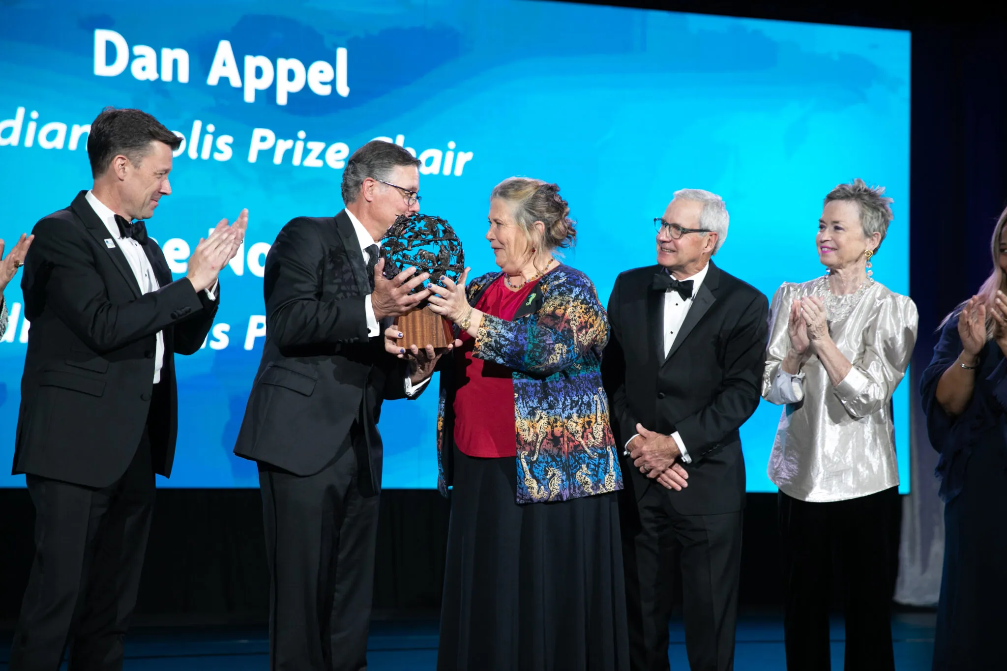 Indianapolis Prize winner receiving award on stage