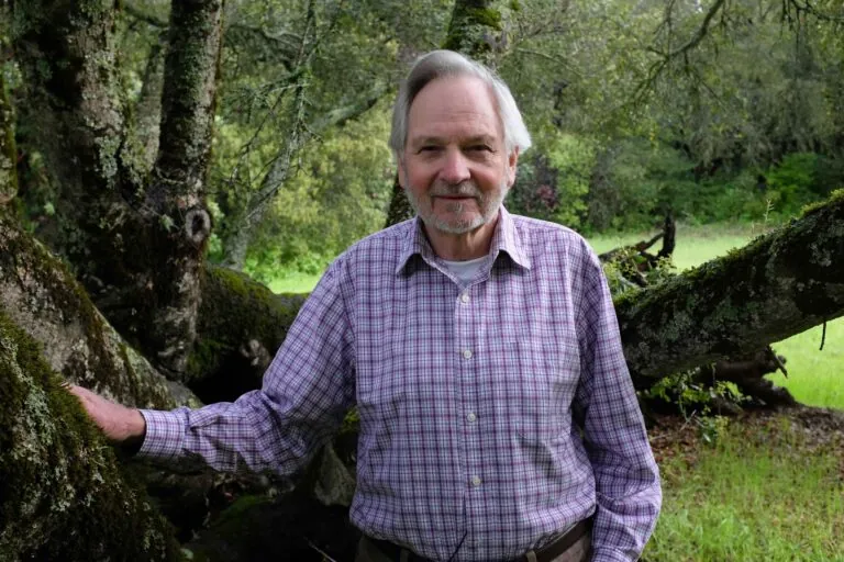 rodney jackson standing with tree