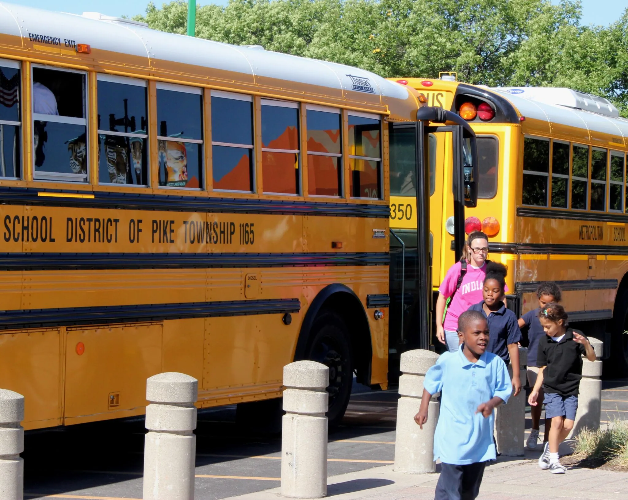 children exiting a bus for a field trip