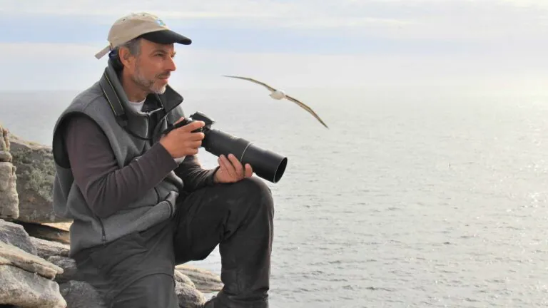 carl_safina_with camera near ocean