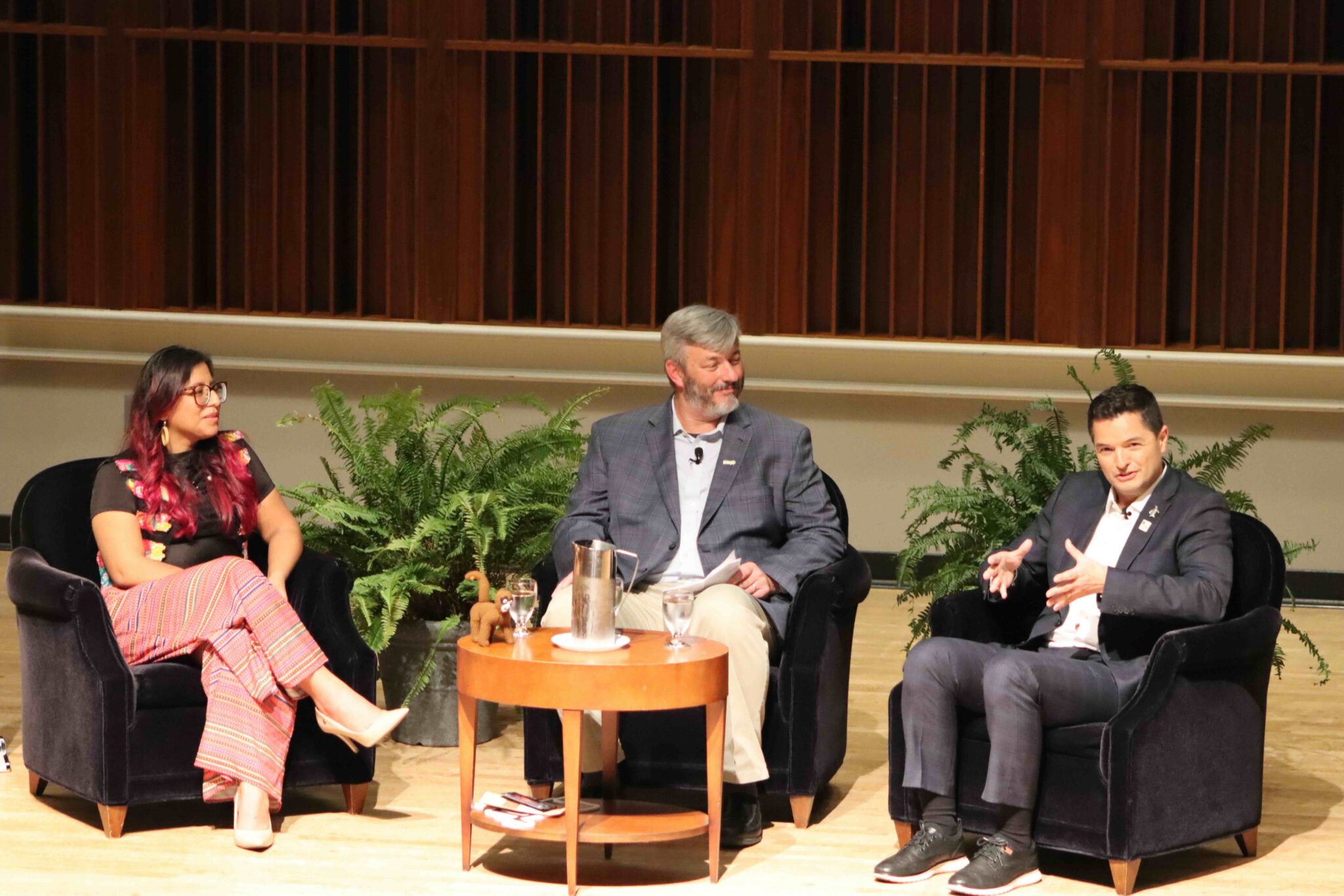 Conservationists on stage talking in open forum
