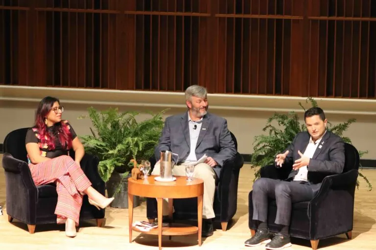 Conservationists on stage talking in open forum