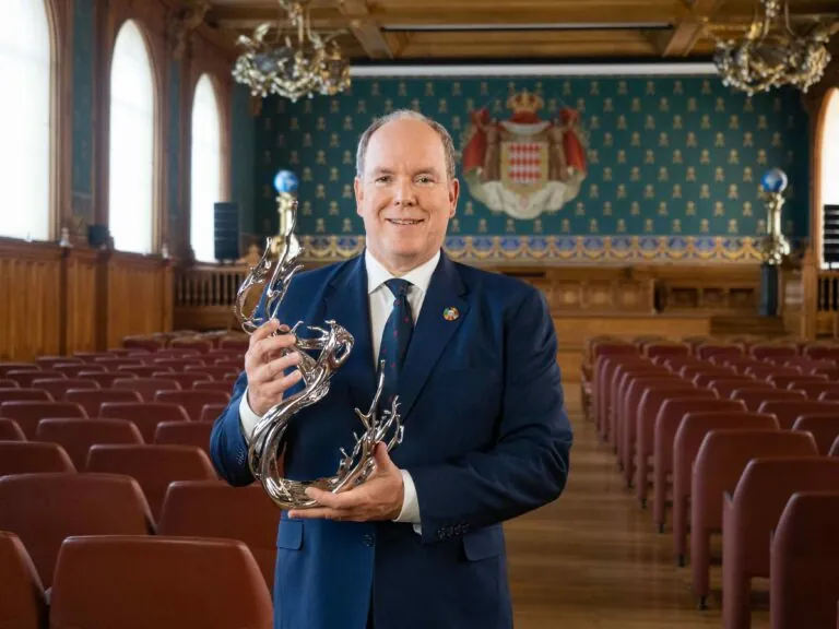 Prince Albert holding Award