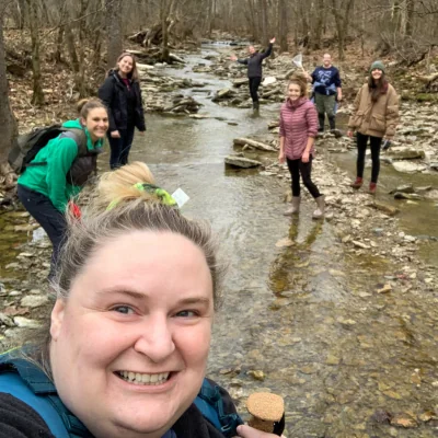 group selfie of people in stream