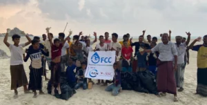 group giving thumbs up on Socotra beach