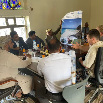 group of men meeting at a table