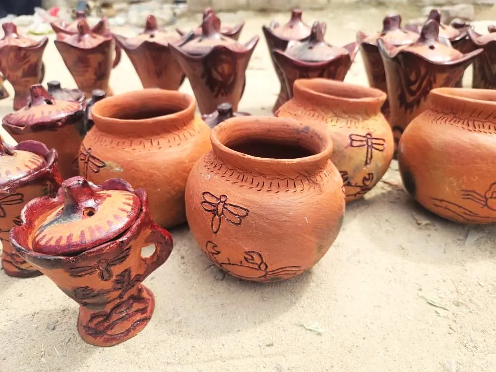clay pots painted and engraved with various animals