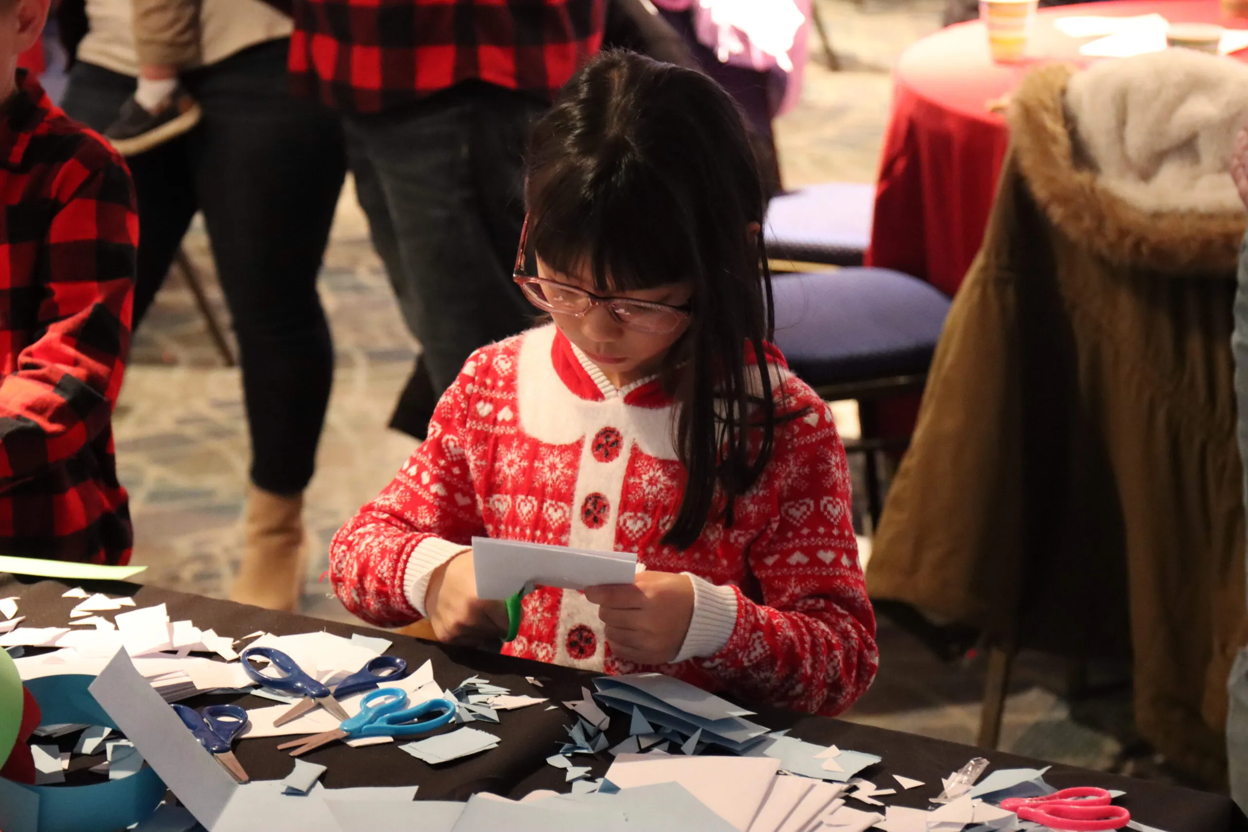 girl doing a holiday craft