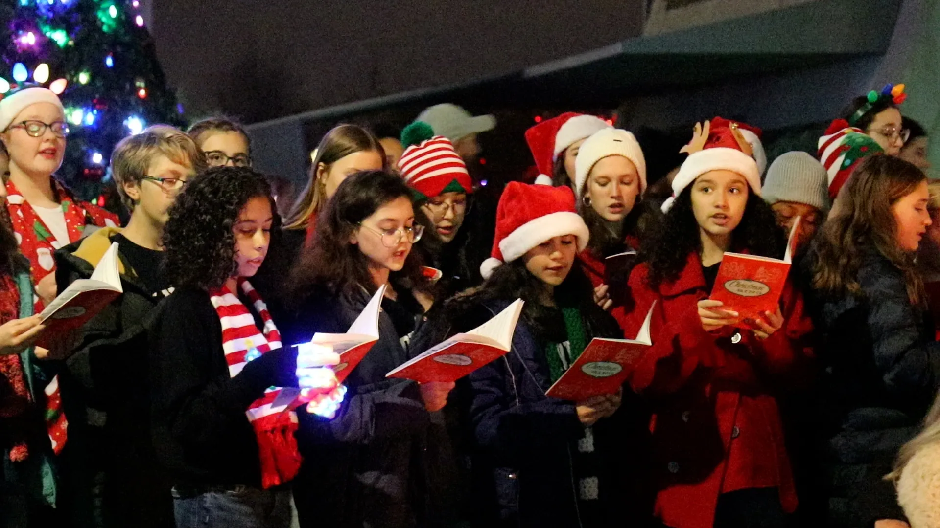 group of youth carolers singing
