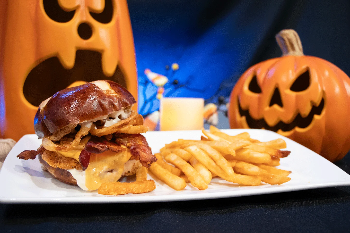 crispy chicken sandwich with fries and halloween decor