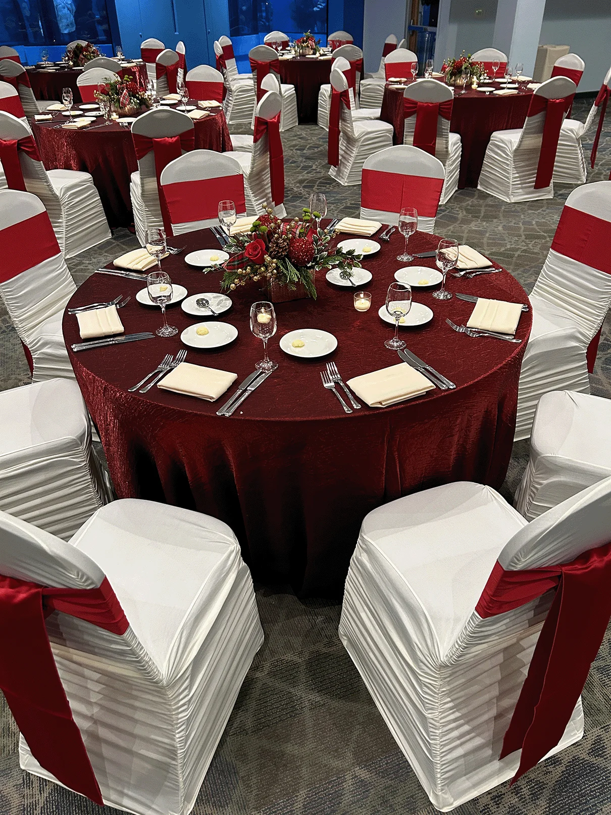 room setup with red christmas themed tables