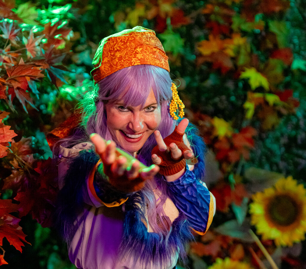 fortune teller clara voyant beckoning to camera