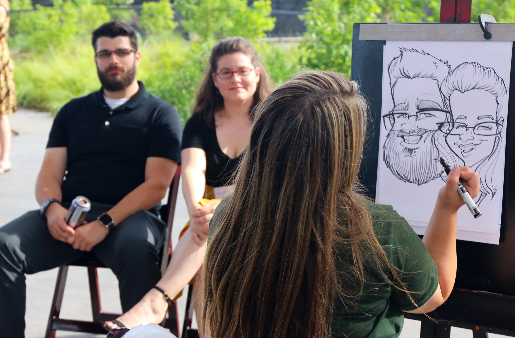 couple getting a caricature