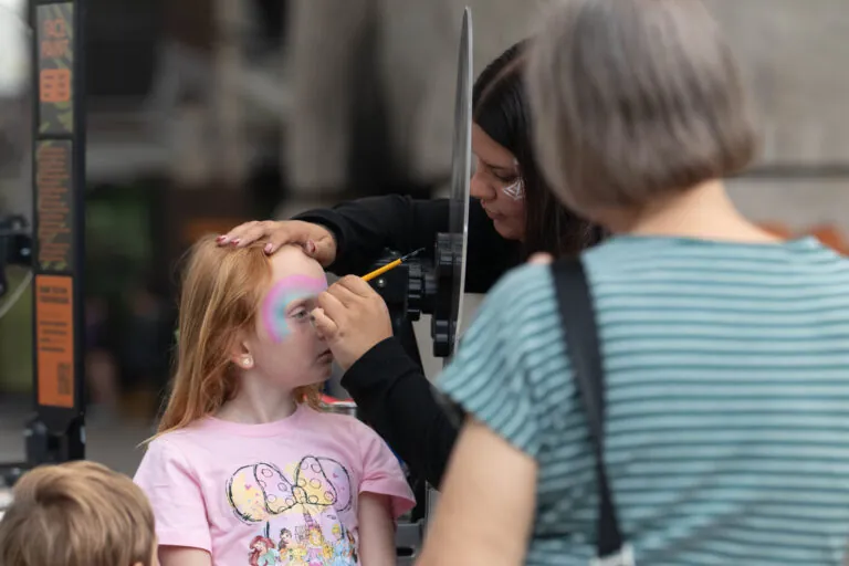 girl getting face painted